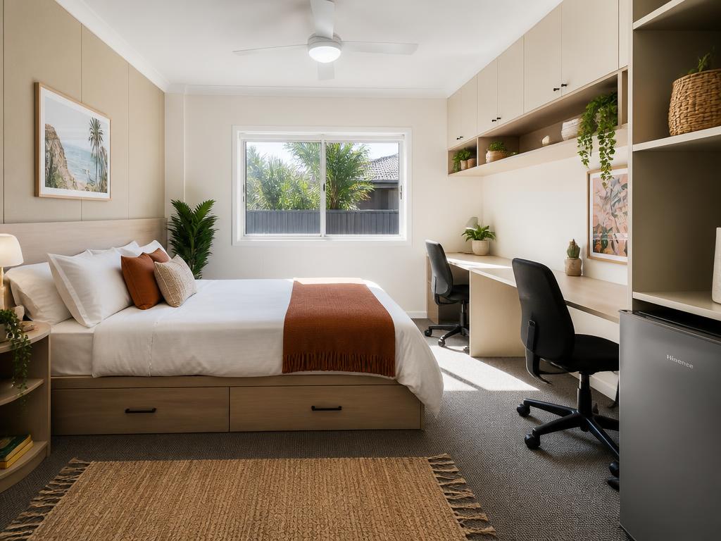 Furnished double room with storage bed, two study desks and a bar fridge
